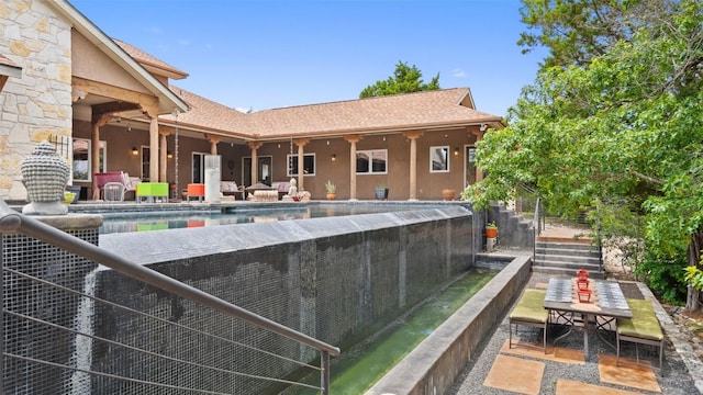 view of swimming pool with stairs and a patio area