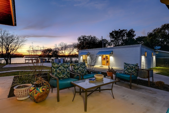 view of patio terrace at dusk