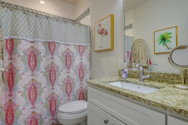 bathroom featuring a shower with curtain, toilet, and vanity