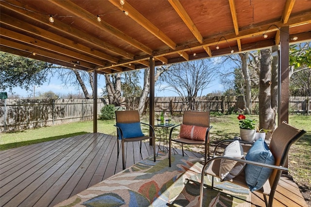 wooden deck featuring a fenced backyard