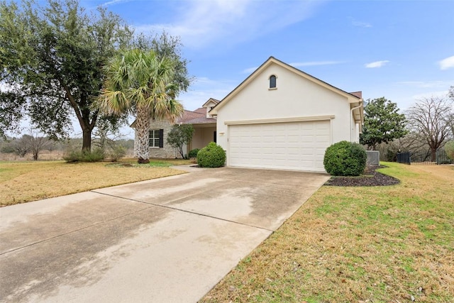 single story home with a front yard, cooling unit, an attached garage, stucco siding, and concrete driveway