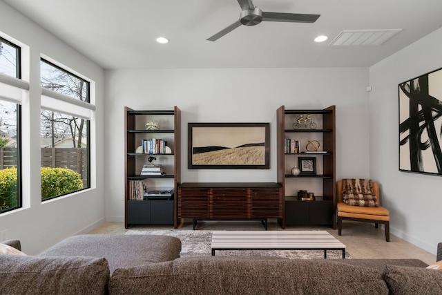 living area with visible vents, recessed lighting, baseboards, and ceiling fan