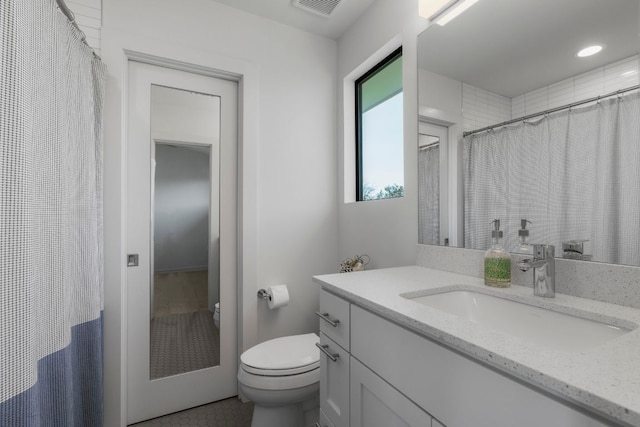 full bath featuring recessed lighting, visible vents, toilet, and vanity