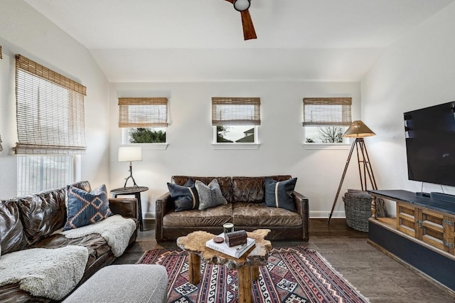 living room featuring baseboards, a ceiling fan, lofted ceiling, and wood finished floors