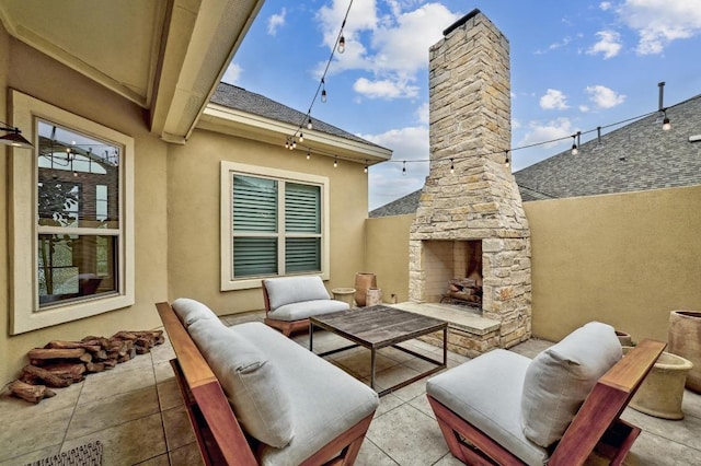 view of patio / terrace featuring an outdoor living space with a fireplace