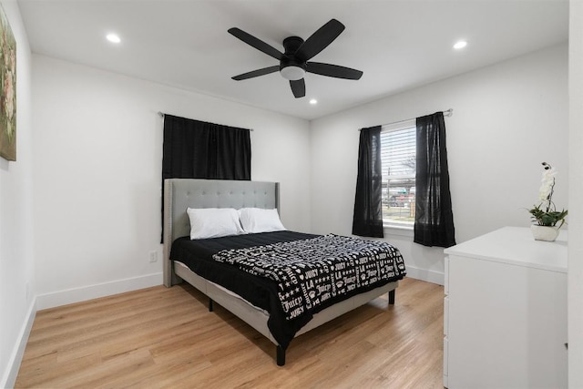 bedroom with recessed lighting, baseboards, and light wood finished floors