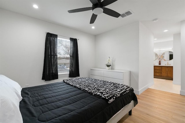 bedroom with recessed lighting, light wood-style floors, visible vents, and baseboards