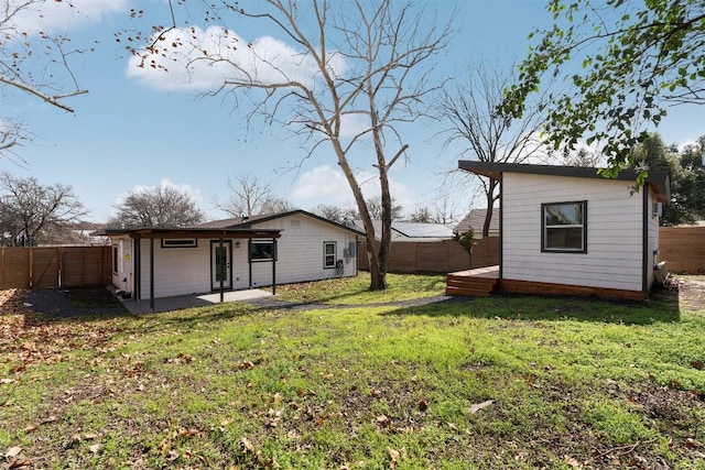 view of yard with a patio and a fenced backyard