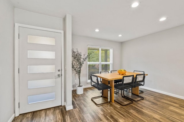 dining room with recessed lighting, dark wood-style floors, and baseboards