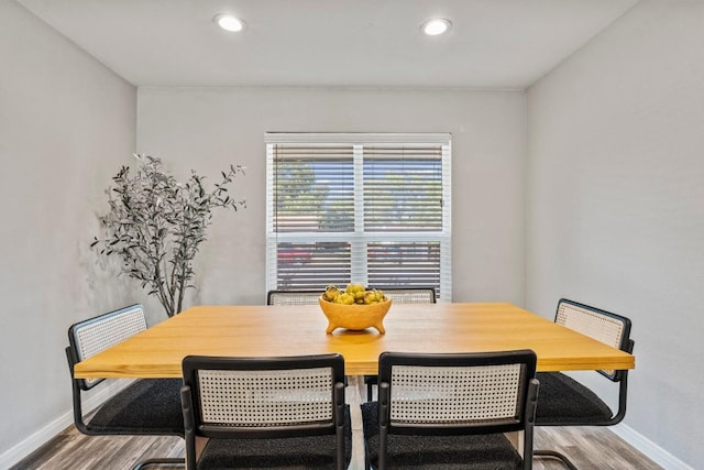 dining area with recessed lighting, baseboards, and wood finished floors