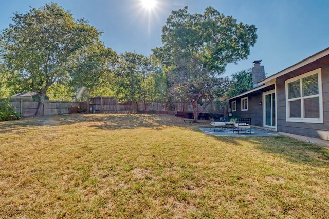 view of yard featuring a patio and a fenced backyard