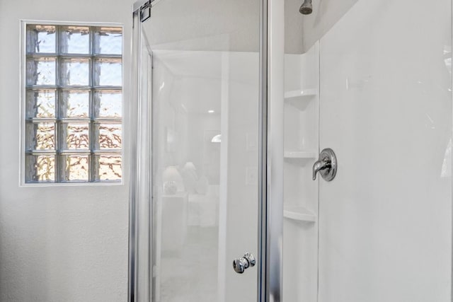 full bath with a shower stall