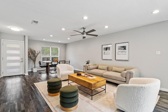 living room with visible vents, baseboards, recessed lighting, dark wood-style floors, and a ceiling fan