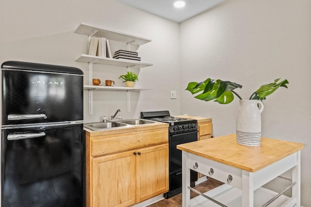 kitchen with black appliances, light brown cabinetry, a sink, open shelves, and wooden counters