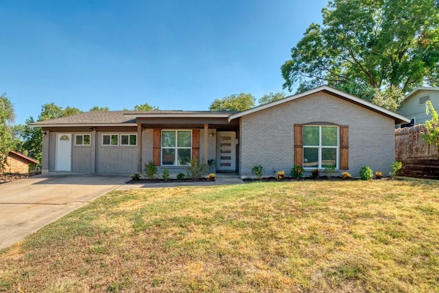 view of front of house with brick siding and a front lawn