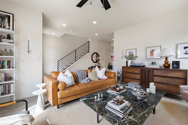 living room featuring stairway, visible vents, baseboards, recessed lighting, and ceiling fan