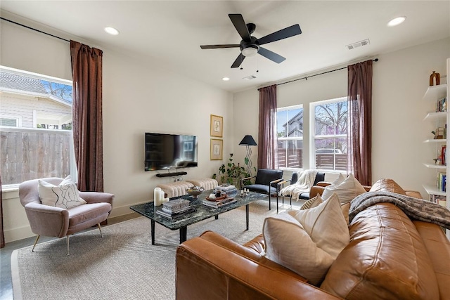 living room featuring visible vents, recessed lighting, baseboards, and ceiling fan