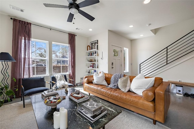 living area featuring stairs, recessed lighting, visible vents, and a ceiling fan