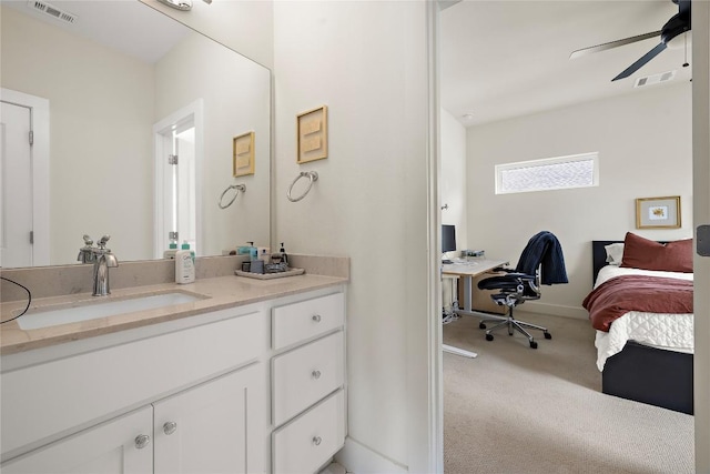 bathroom with visible vents, ceiling fan, and vanity