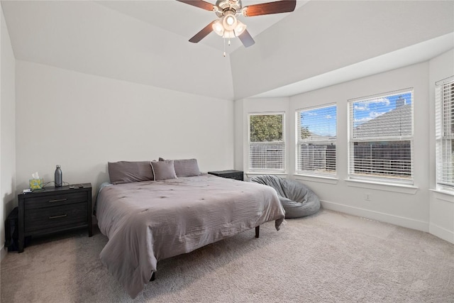 bedroom with lofted ceiling, carpet flooring, baseboards, and ceiling fan