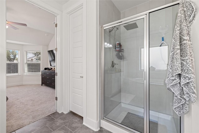 full bath with a stall shower, a ceiling fan, and vaulted ceiling