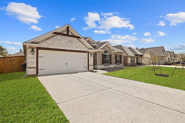 view of front of property featuring a front yard, concrete driveway, fence, and an attached garage