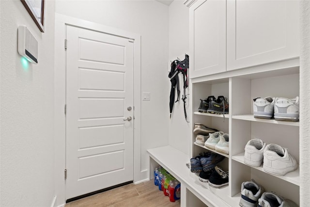 mudroom with light wood-style flooring