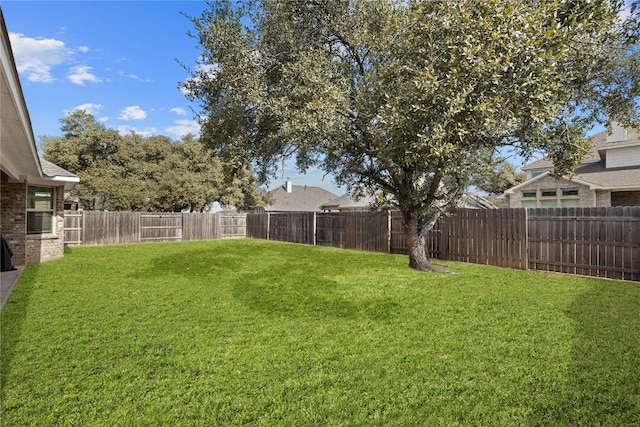 view of yard featuring a fenced backyard