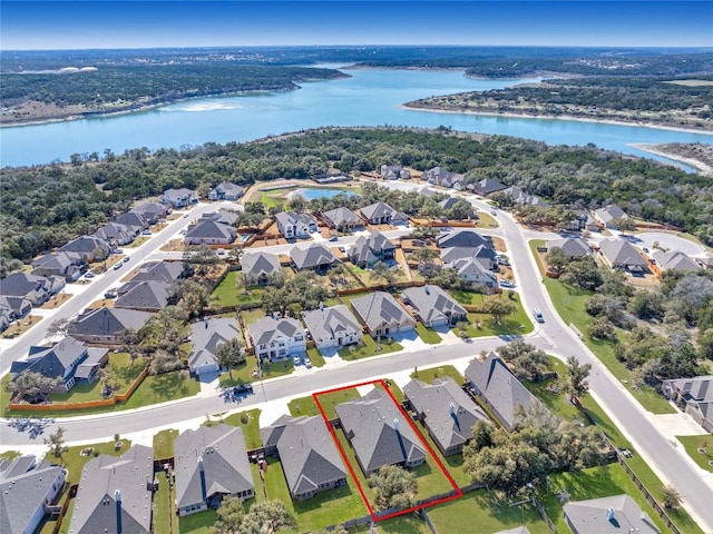 aerial view with a residential view and a water view