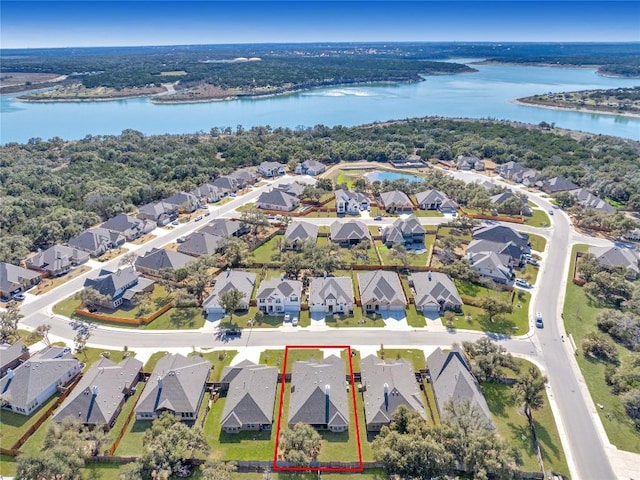 bird's eye view with a residential view and a water view