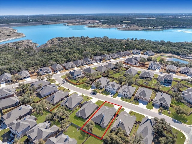 birds eye view of property with a residential view and a water view