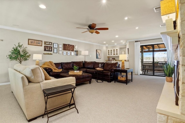 living room with light colored carpet, visible vents, and ornamental molding