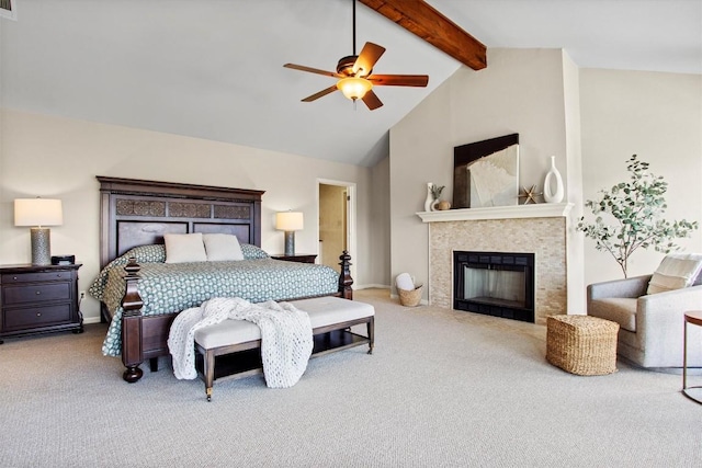 carpeted bedroom with ceiling fan, baseboards, beam ceiling, a fireplace, and high vaulted ceiling