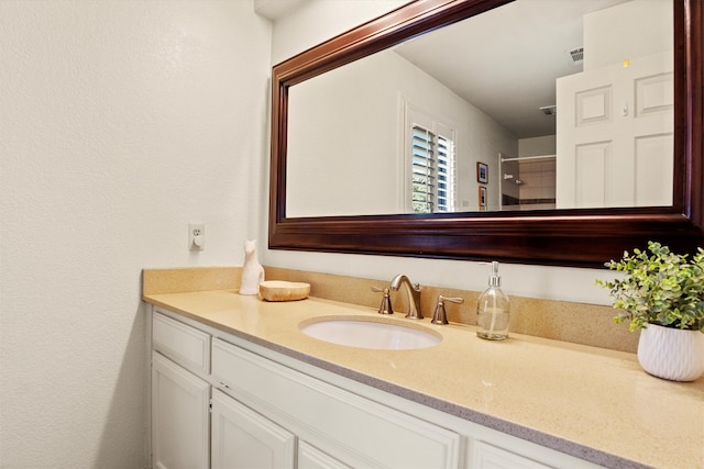 bathroom with vanity and visible vents