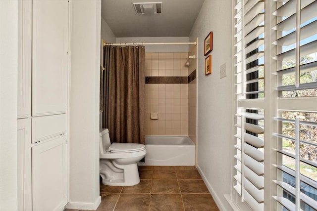 full bathroom with tile patterned floors, visible vents, toilet, shower / tub combo, and baseboards