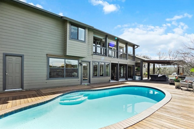 outdoor pool with outdoor lounge area