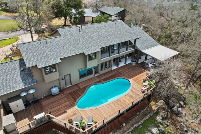 view of swimming pool featuring a wooden deck