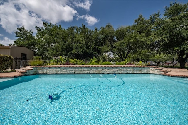194 Brushy Creek Trl, Hutto, TX 78634 - view of pool featuring fence and view of scattered trees