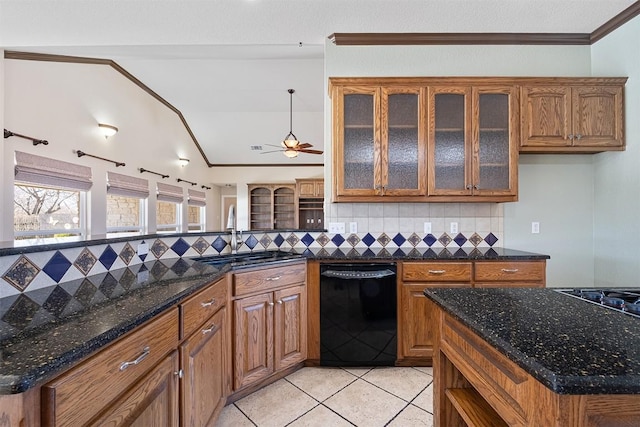 194 Brushy Creek Trl, Hutto, TX 78634 - kitchen featuring black appliances, a sink, brown cabinetry, tasteful backsplash, and light tile patterned flooring
