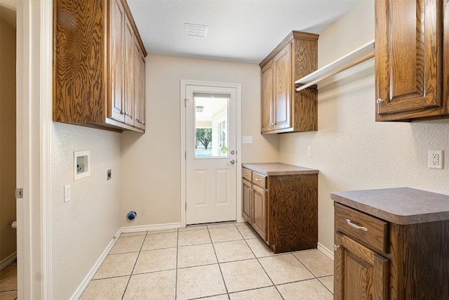 194 Brushy Creek Trl, Hutto, TX 78634 - washroom featuring cabinet space, hookup for an electric dryer, washer hookup, and baseboards