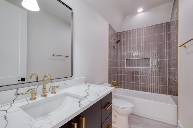 full bath featuring tile patterned flooring, toilet, vanity, and bathtub / shower combination