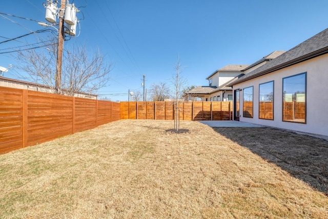 view of yard featuring a fenced backyard