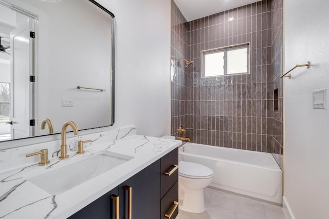 bathroom featuring vanity, toilet, tile patterned flooring, and shower / bathtub combination