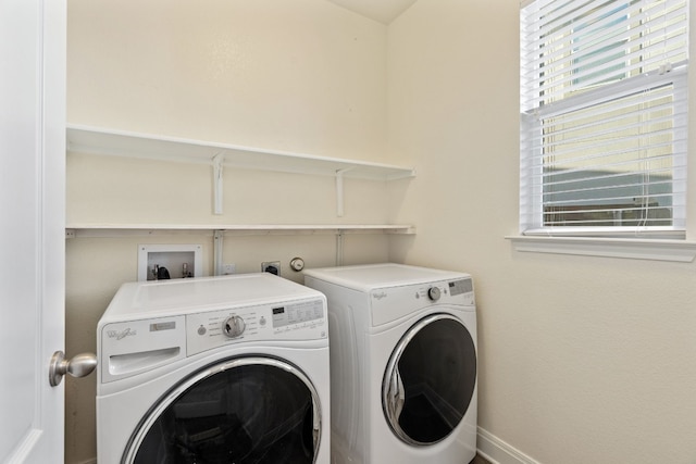 1429 Freer Cv, Leander, TX 78641 - laundry area featuring washing machine and clothes dryer and baseboards