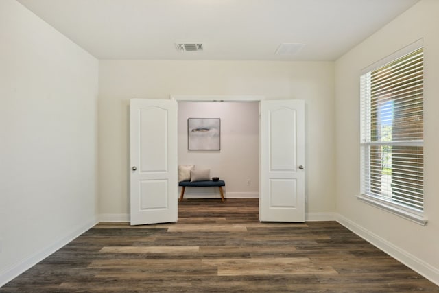 1429 Freer Cv, Leander, TX 78641 - unfurnished room featuring dark wood-style floors and plenty of natural light