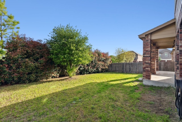 view of yard featuring a patio area and fence