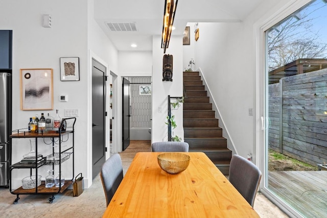 dining space with visible vents, recessed lighting, stairs, and baseboards