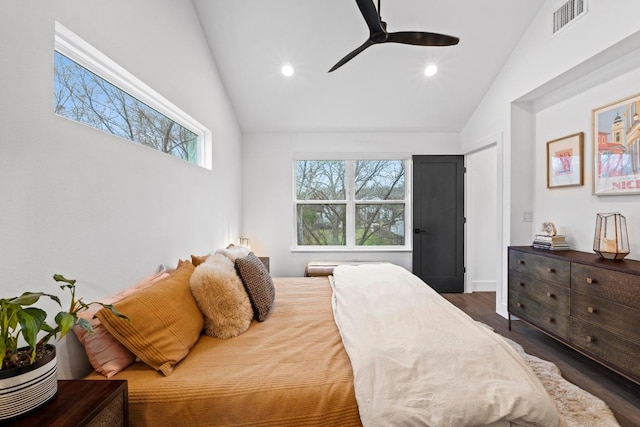 1207 Luna St Unit 2, Austin, TX 78721 - bedroom with vaulted ceiling, multiple windows, wood finished floors, recessed lighting, and a ceiling fan