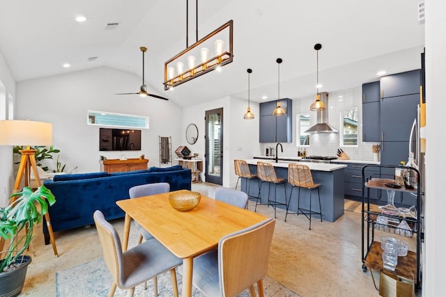 dining space featuring a ceiling fan, visible vents, lofted ceiling, recessed lighting, and finished concrete floors