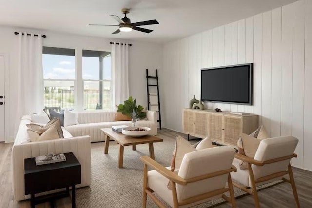 living area featuring ceiling fan and wood finished floors